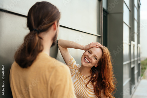 Happy young woman chatting to her boyfriend