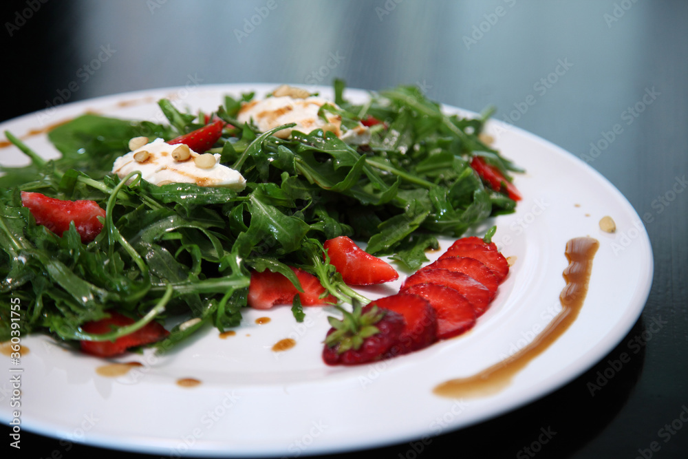 Salad with arugula, cream cheese and strawberries. Salad with arugula and strawberries. Rucola and strawberries. Salad with arugula, cream cheese and strawberries. Salad with arugula and strawberries. Rucola and strawberries.