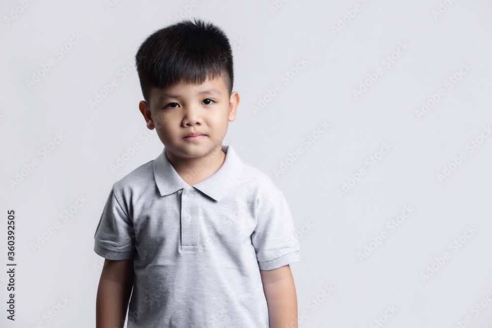 Cute little child having fun. studio portrait on gray background Cute little child having fun. studio portrait on gray background