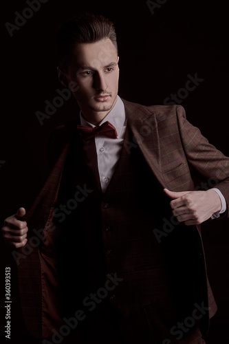 elegant dude in brown suit