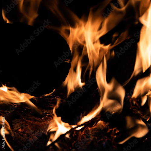 Close-up of a pile of burning wood with flames. Environmental concept