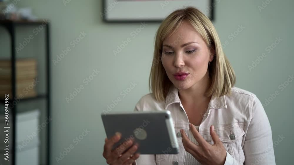 blogger woman is talking with followers by tablet, online webinar, internet communicating blogger woman is talking with followers by tablet, online webinar, internet communicating