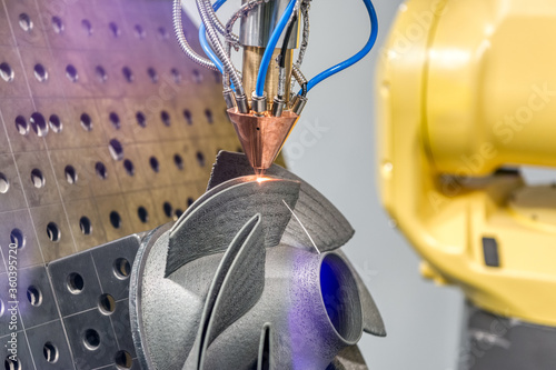 Fototapeta Naklejka Na Ścianę i Meble -  3D metal printer produces a steel part.