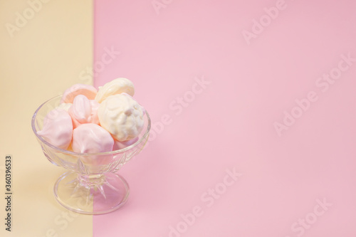  multi-colored meringues on a plain background
