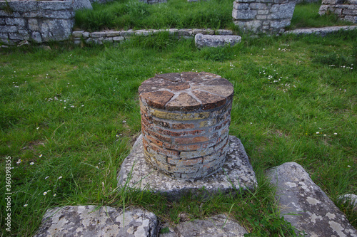 Pietrabbondante - Italian Sanctuary - Remains of a column that supported the portico where the ancient shops stood - Molise - Italy photo