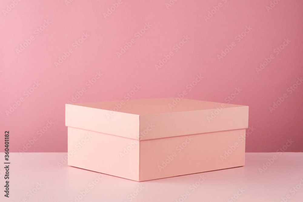 Holiday pink background with paper gift box and Space for text. Valentine's Day, Happy Women's Day, Mother's Day, Birthday.