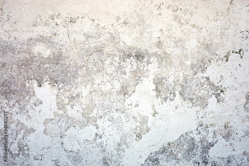 White texture concrete wall. Painted fade background with grey solid floor grain. Rough and dirty surface. © wertinio