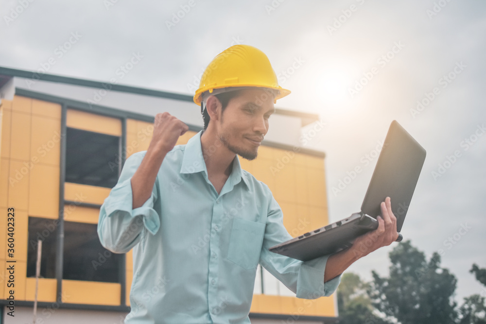 Businessman holding computer inspection construction building estate site Businessman holding computer inspection construction building estate site