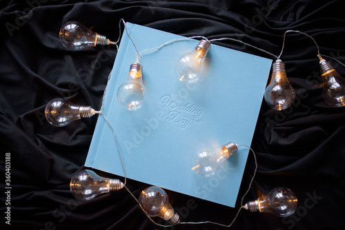 Blue wedding photo book with the inscription 