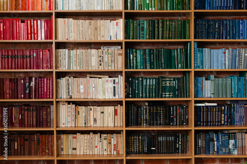 View of shelves with old books in library