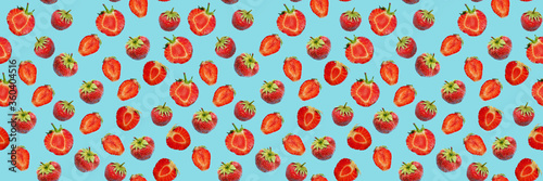 Seamless food pattern, ripe strawberries on a blue background. 