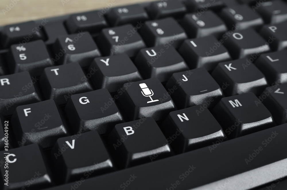 Microphone flat icon on black computer keyboard button, Business communication online concept Microphone flat icon on black computer keyboard button, Business communication online concept