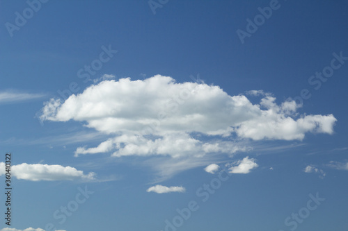 A big fluffy cloud in the blue sky