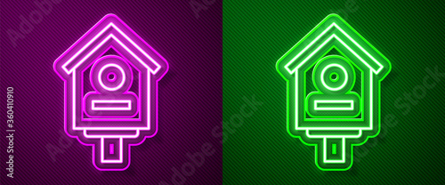 Glowing neon line Bird house icon isolated on purple and green background. Nesting box birdhouse, homemade building for birds. Vector Illustration.