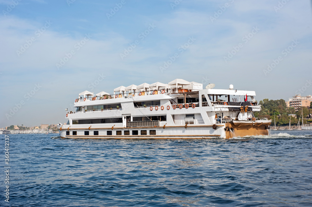 Large egyptian river cruise boat sailing on Nile Large egyptian river cruise boat sailing on Nile