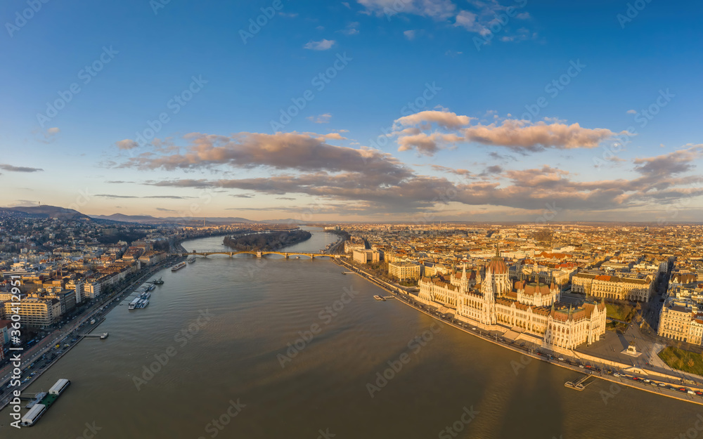 Aerial drone view of Hungarian Parliament and Margaret island in Danube river in Budapest sunset