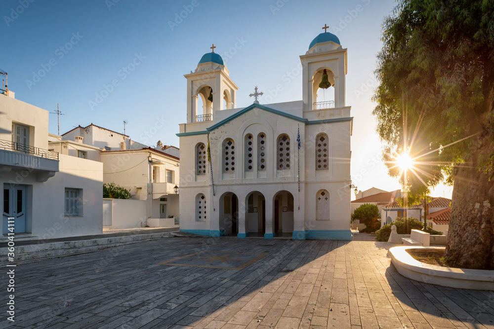 The beautiful church of St. George in Chora town on Andros island, Cyclades, Greece, during a summer sunrise without people