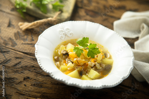 Traditional homemade mushroom soup with fresh parsley