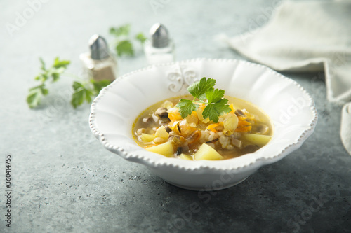 Traditional homemade mushroom soup with fresh parsley
