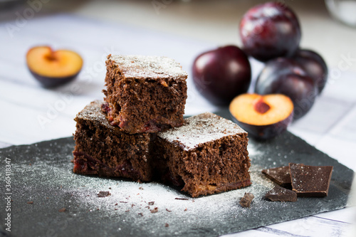 Photos Delicious chocolate cake with plums.