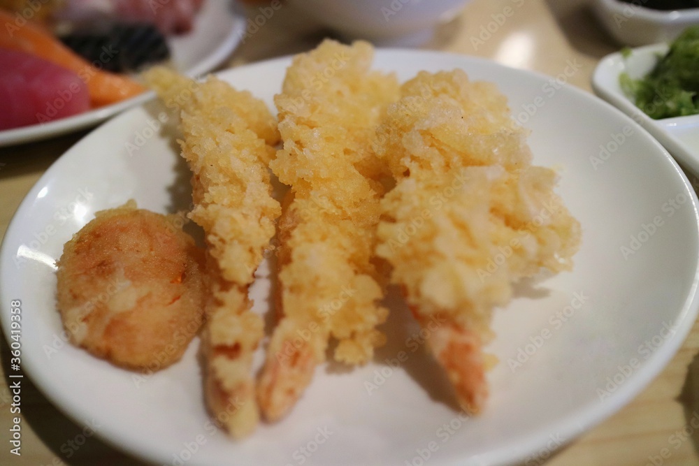 Tempura shrimps, deep fried shrimp,  with tempura vegetables on white plate. Famous japanese food. Food concept.