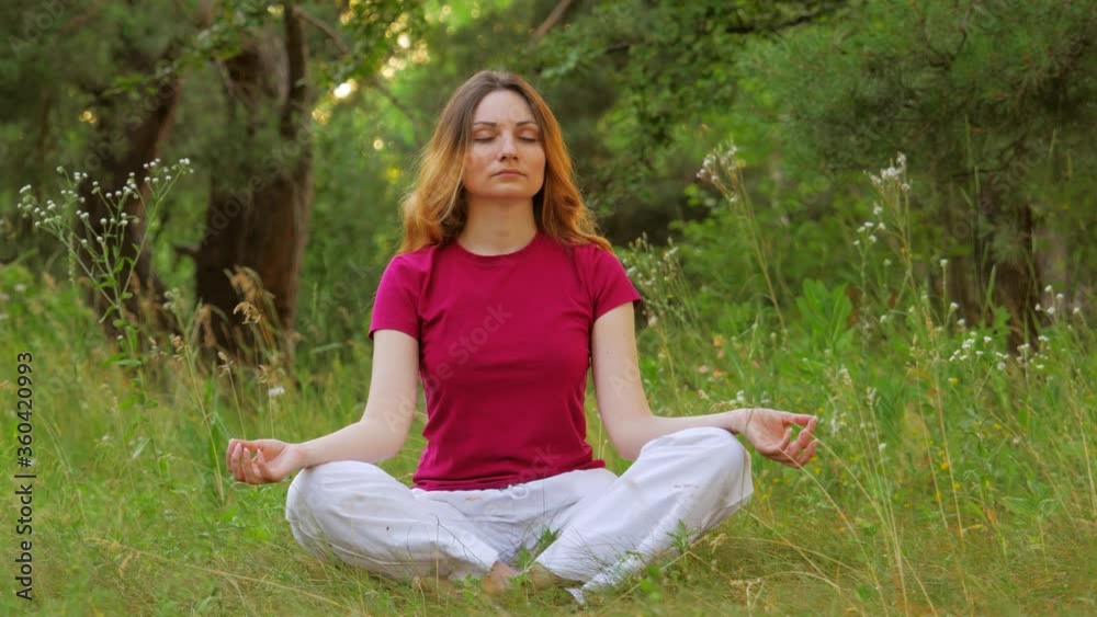 girl meditates in lotus position during yoga classes close-up girl meditates in lotus position during yoga classes close-up