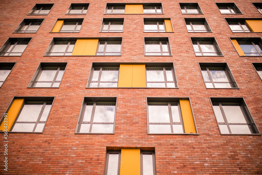 old brick building.A wall with many windows. old brick building.A wall with many windows.
