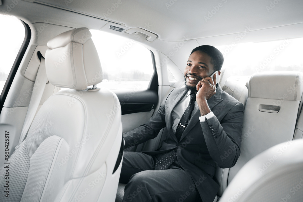 Businessman Talking On Phone Sitting In Car During Business Trip Businessman Talking On Phone Sitting In Car During Business Trip