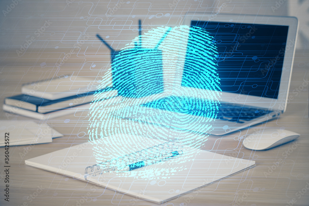 Computer on desktop in office with finger print drawing. Double exposure. Concept of business data security. Computer on desktop in office with finger print drawing. Double exposure. Concept of business data security.