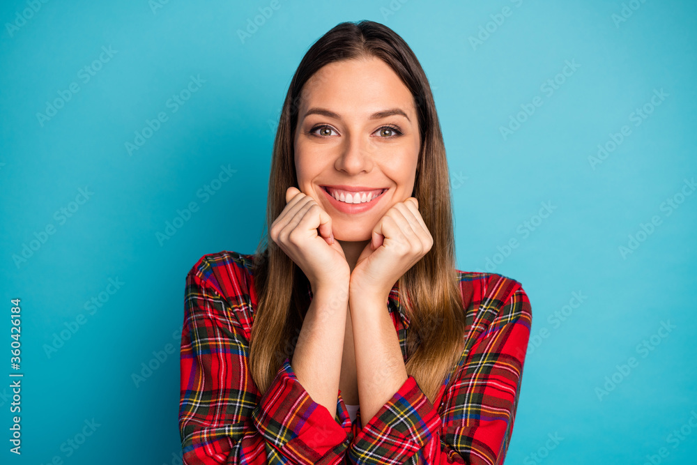 Close-up portrait of her she nice attractive lovely lovable cute winsome cheerful cheery girl wearing checked shirt enjoying isolated on bright vivid shine vibrant blue color background Close-up portrait of her she nice attractive lovely lovable cute winsome cheerful cheery girl wearing checked shirt enjoying isolated on bright vivid shine vibrant blue color background