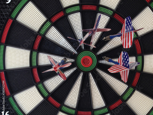 Bullseye darts dartboard with american and britain flag trade political allies concept