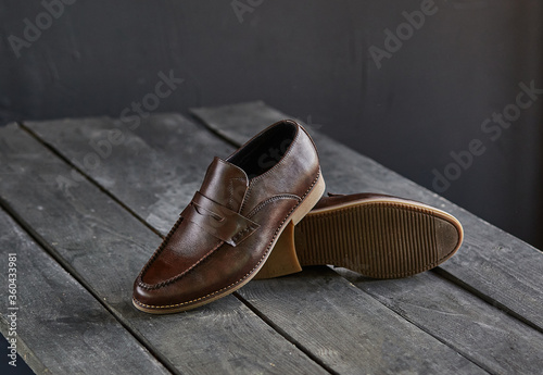 brown loafers on a wooden