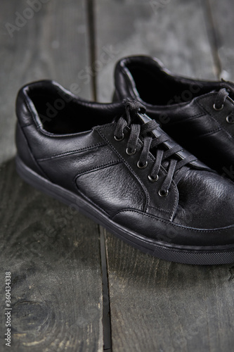 black shoes on a wooden