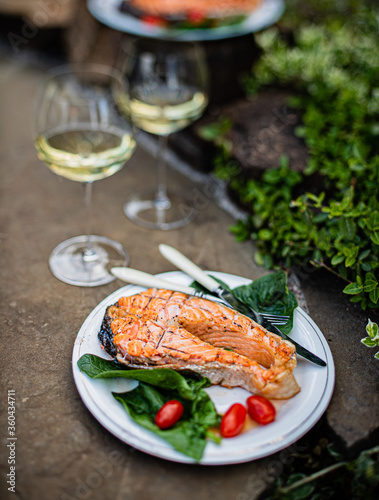 Fototapeta Naklejka Na Ścianę i Meble -  grilled salmon with salad and wine