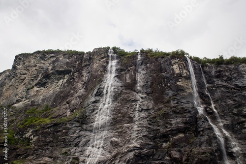 Scenic view of Geirangerfjord with waterfalls from boat trip through the fjord  Norway