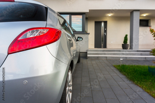 House driveway with a car parked on the front