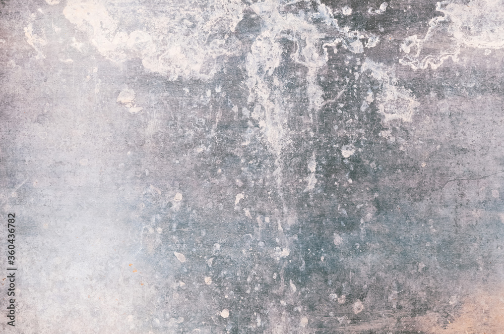 Concrete wall background. Stained texture. Silver metal gray distressed surface with white splatters.
