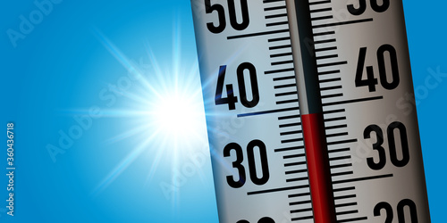 Concept de la canicule avec un thermomètre pris en gros plan pour montrer la hausse des températures suite au réchauffement climatique.