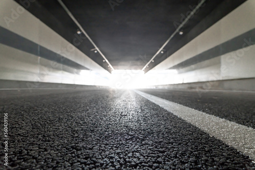 low angle view apshalt road in tunnel with copy space. photo