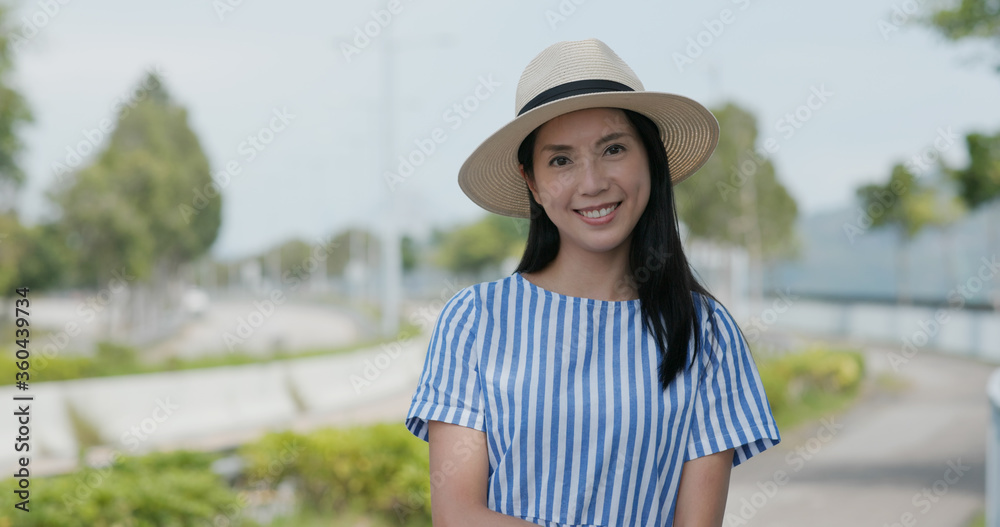Travel woman with straw hat and smile to camera
