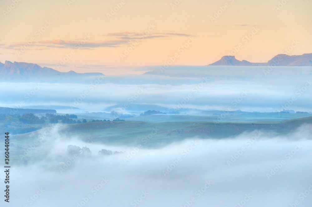 FOG BANKS collect in the valleys between foothills of the Drakensberg mountains, kwazulu Natal, south Africa