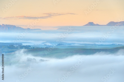 FOG BANKS collect in the valleys between foothills of the Drakensberg mountains, kwazulu Natal, south Africa