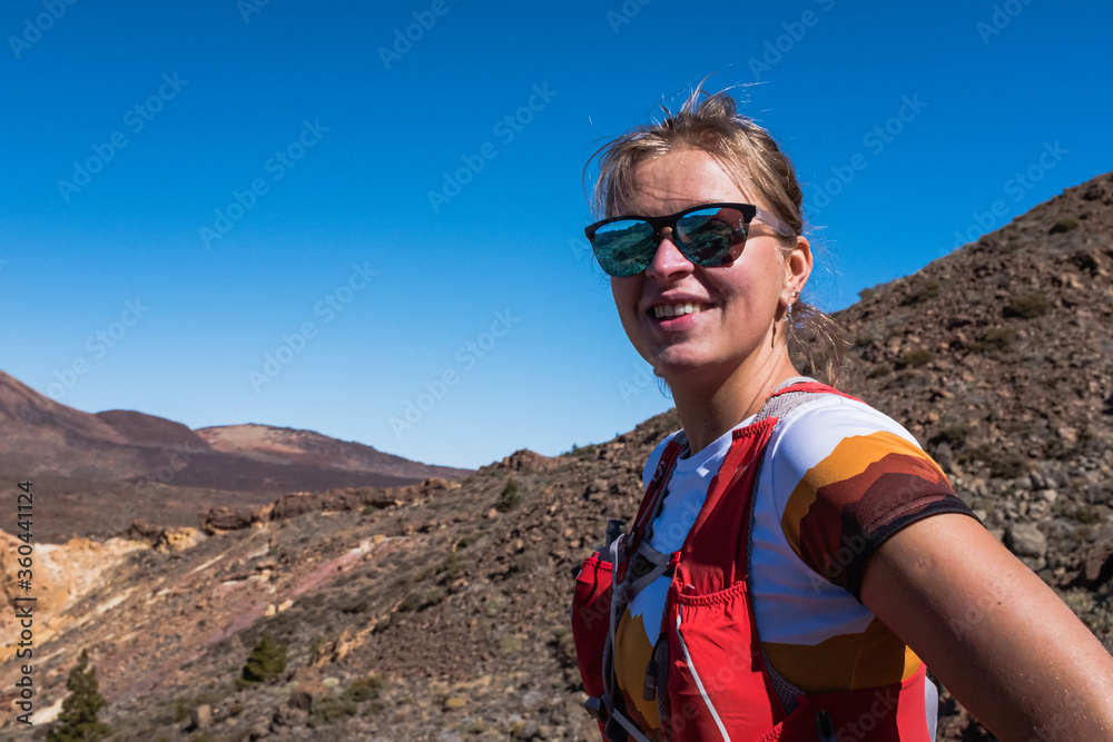 Portrait of the sport running woman in cross country trail run Portrait of the sport running woman in cross country trail run