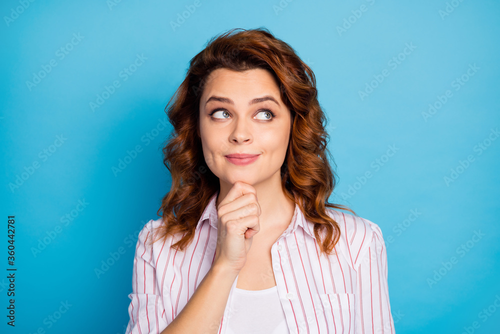 Closeup photo of pretty charming wavy lady look side up empty space intelligent creative person arm on chin wear white striped shirt isolated bright blue color background Closeup photo of pretty charming wavy lady look side up empty space intelligent creative person arm on chin wear white striped shirt isolated bright blue color background