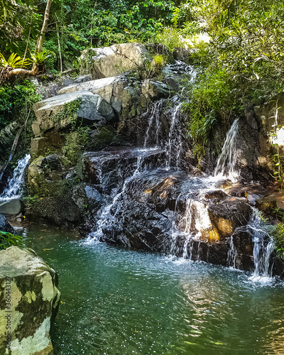 Waterfall and mountaina river in the Yanoda park, Hainan photo