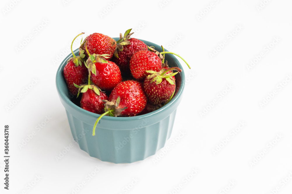 strawberries in a bowl on a white background strawberries in a bowl on a white background