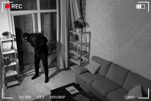Bilde på lerret Thief With Crowbar Entering Into House View From Camera