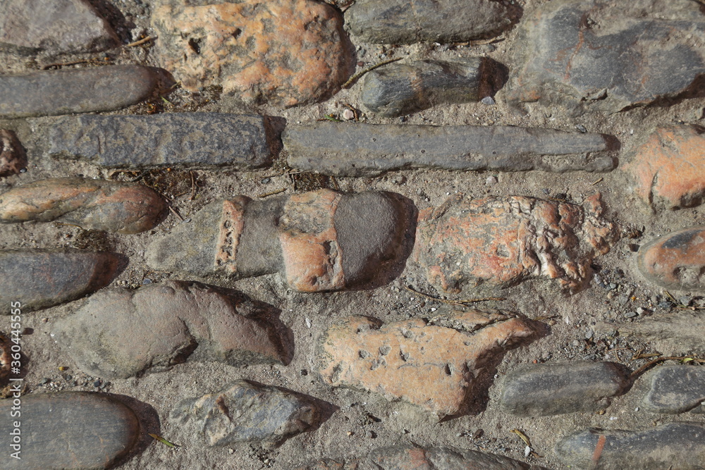 A closeup view of traditional cobbles in a Cornish village, England, UK. A closeup view of traditional cobbles in a Cornish village, England, UK.