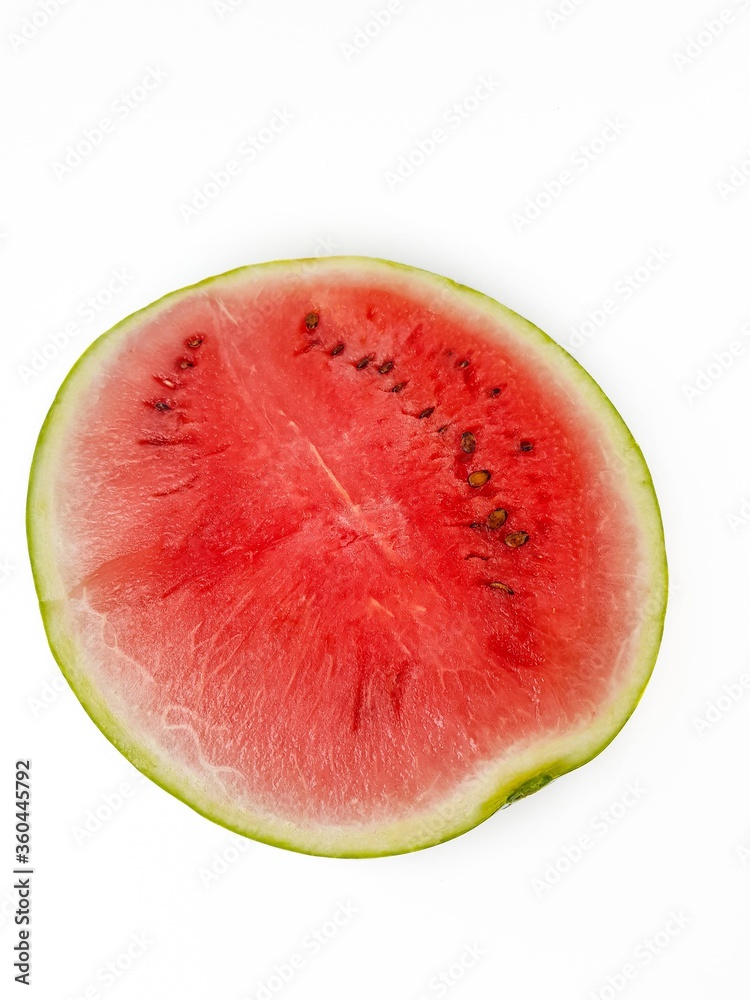 Bright ripe juicy red watermelon cut with black seeds on a white background. Bright ripe juicy red watermelon cut with black seeds on a white background.