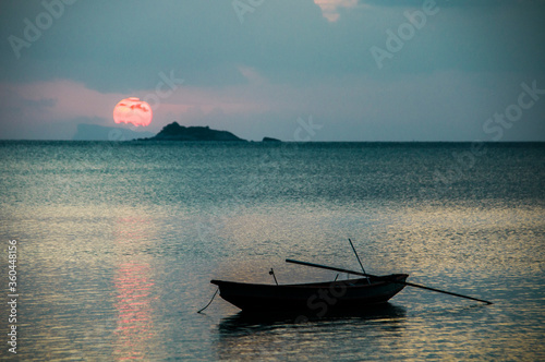 Fishing boat on a beautiful sunset background